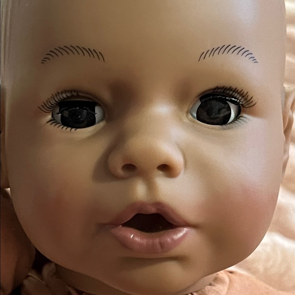 14.5 inches long. MADAME ALEXANDER doll. EC. Open and shut eyes. Sucks thumb.